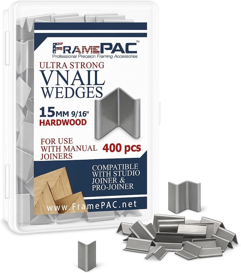 Installing FramePac V Nails Steel Picture Frame Hardware on a wooden workbench